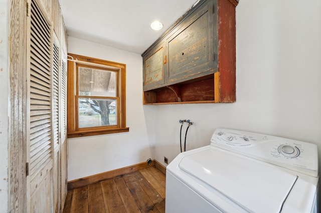 laundry area featuring cabinets, washer / clothes dryer, and dark wood-type flooring