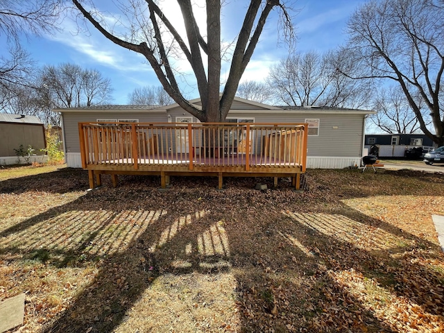 rear view of property with a deck