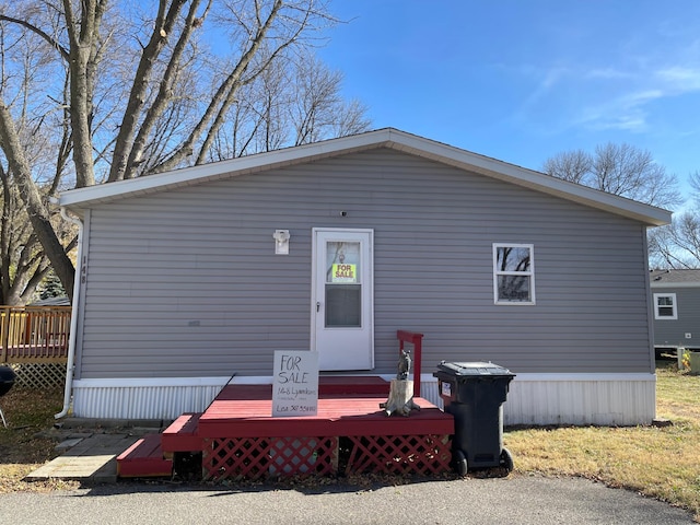 view of front of property featuring a wooden deck