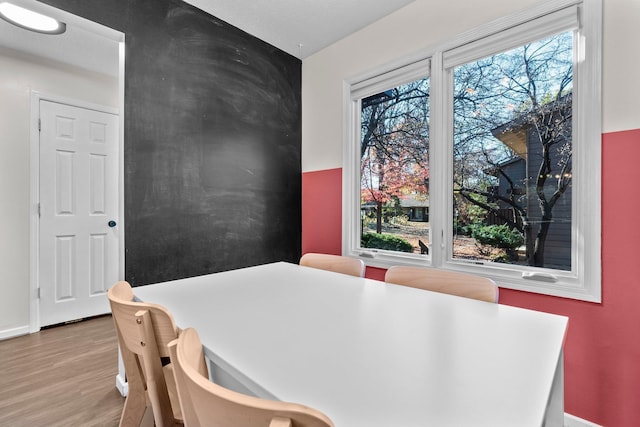 dining area with light wood-type flooring