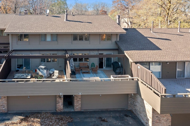 rear view of property featuring an outdoor living space