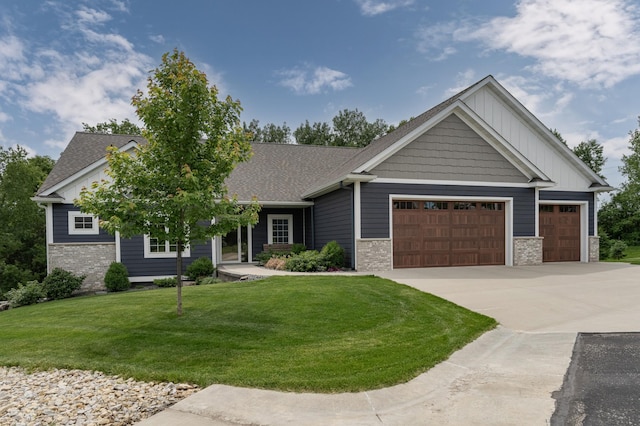 craftsman-style home featuring a garage and a front yard