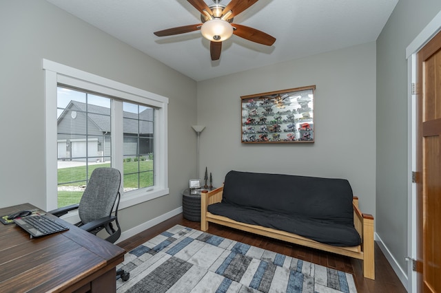 office area featuring ceiling fan and dark hardwood / wood-style floors