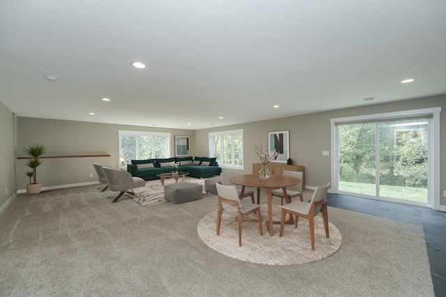 dining space featuring light colored carpet