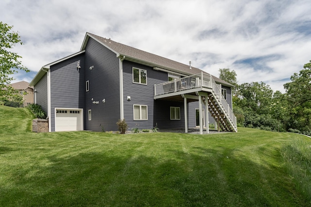 back of house featuring a garage, a lawn, and a wooden deck