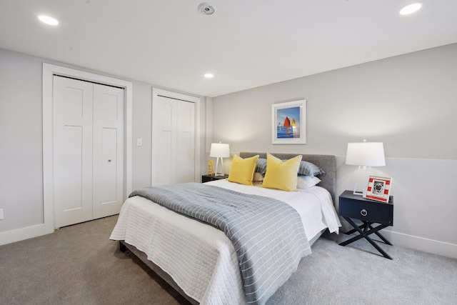 carpeted bedroom with multiple closets