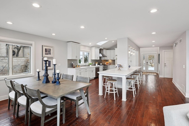 dining space with dark hardwood / wood-style flooring and sink