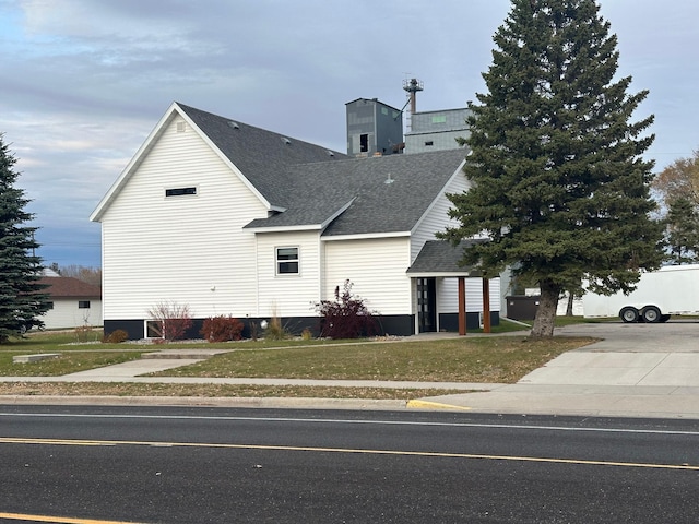 exterior space with a garage and a front yard