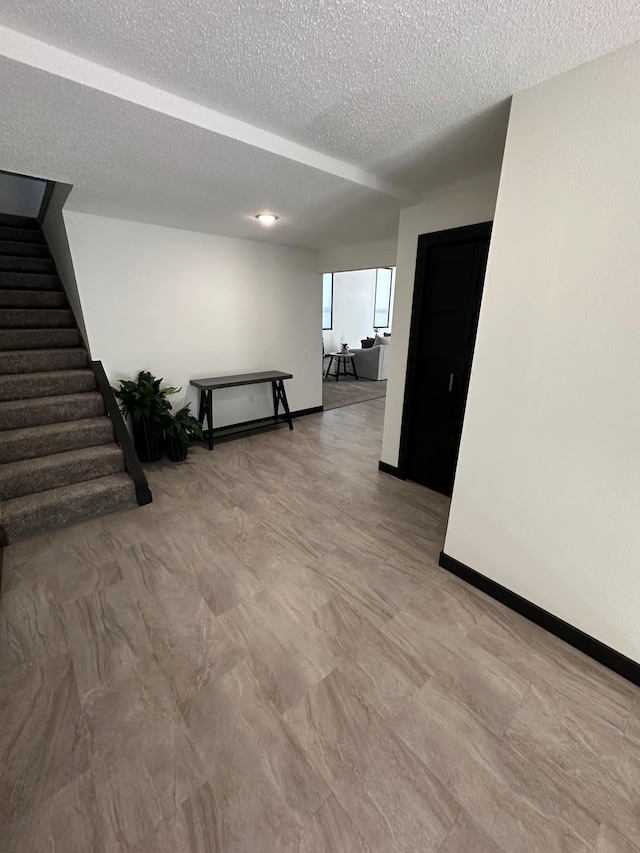 empty room featuring a textured ceiling