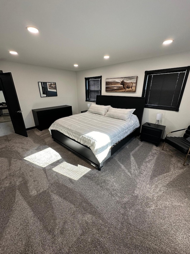 bedroom with dark colored carpet