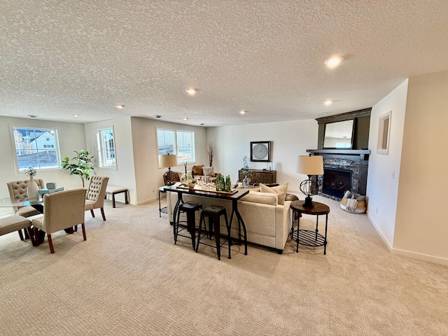 carpeted living room with a textured ceiling