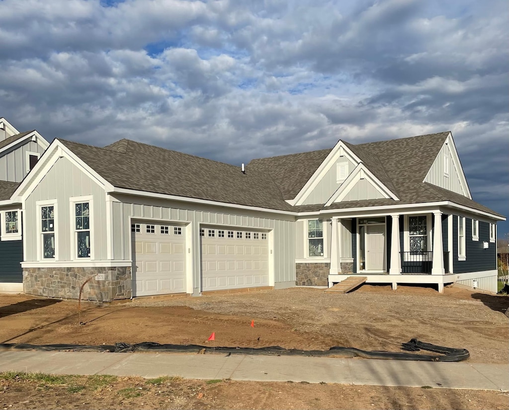 11531 Arnie Way N, Lake Elmo, MN 55042 - view of front of house featuring a porch and a garage