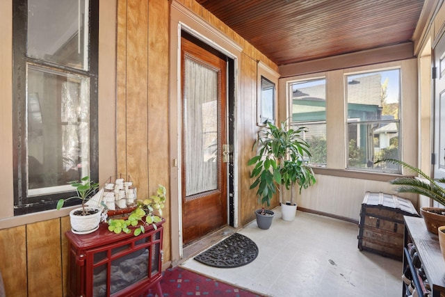 sunroom featuring wooden ceiling