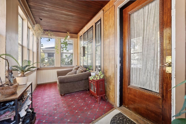 sunroom featuring wooden ceiling