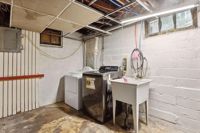 basement with electric panel and independent washer and dryer