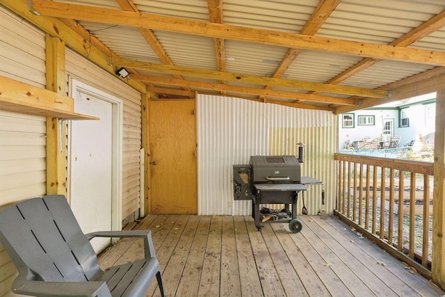 wooden terrace with area for grilling