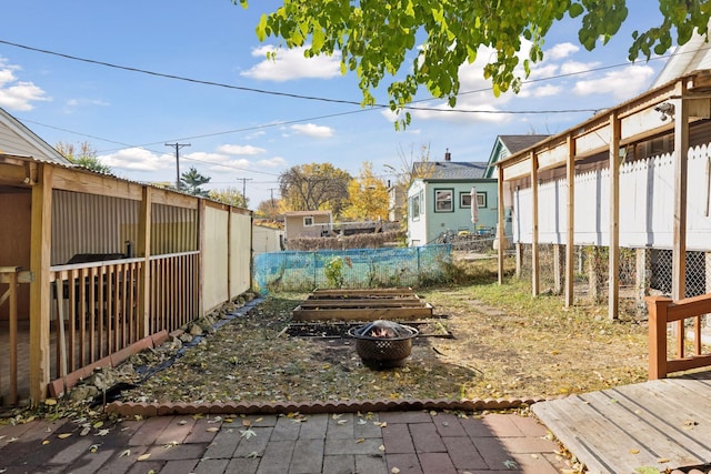 view of yard with an outdoor fire pit