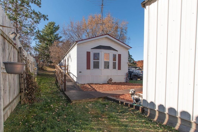 view of home's exterior featuring a yard