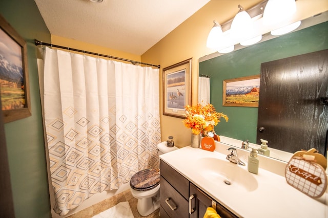 bathroom featuring vanity, a shower with shower curtain, and toilet