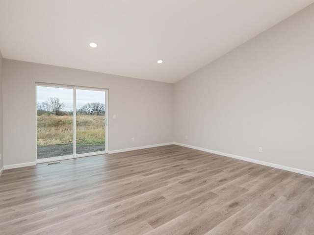 unfurnished room featuring light hardwood / wood-style flooring