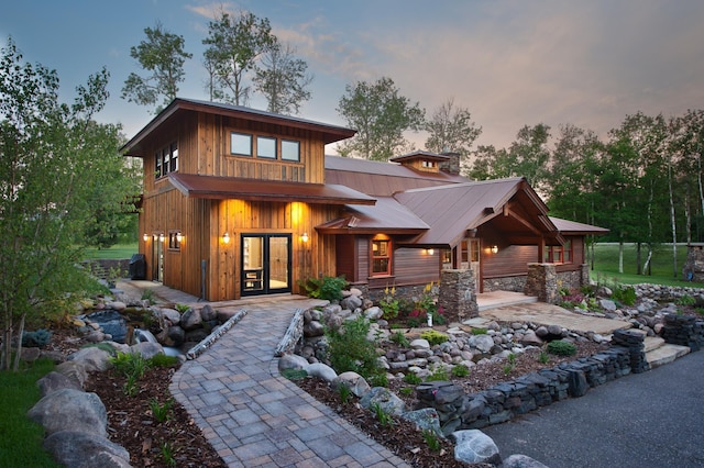 33816 County Road 3, Crosslake, MN 56442 - view of front of property with french doors, metal roof, and stone siding