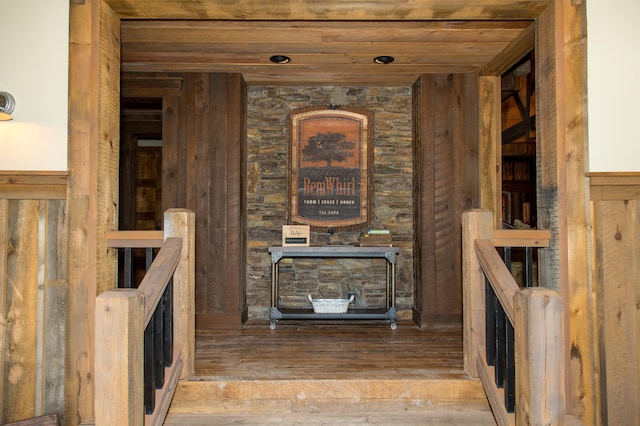 interior space with wood ceiling and hardwood / wood-style flooring