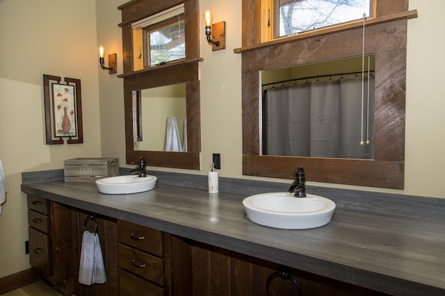 bathroom with vanity and a healthy amount of sunlight