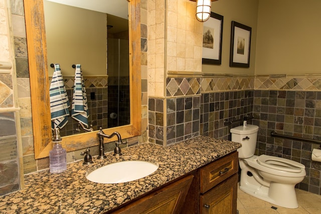 bathroom featuring tile walls, tile patterned flooring, vanity, and toilet