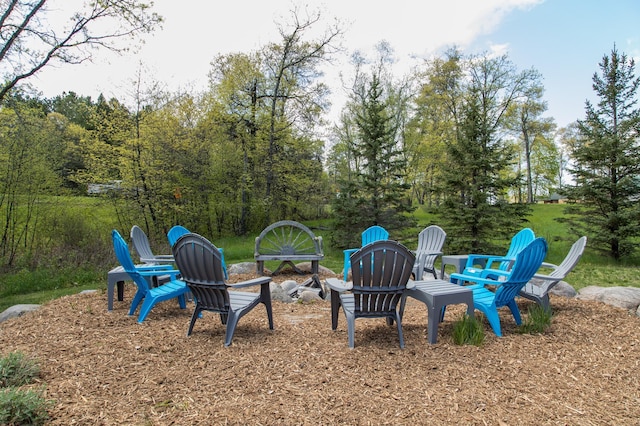 view of yard with a fire pit