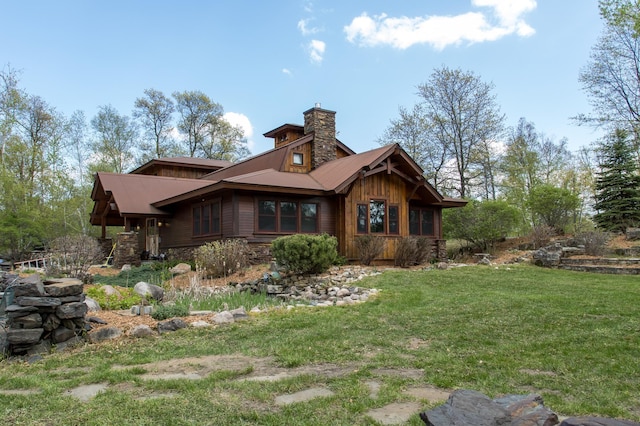 back of house featuring a yard