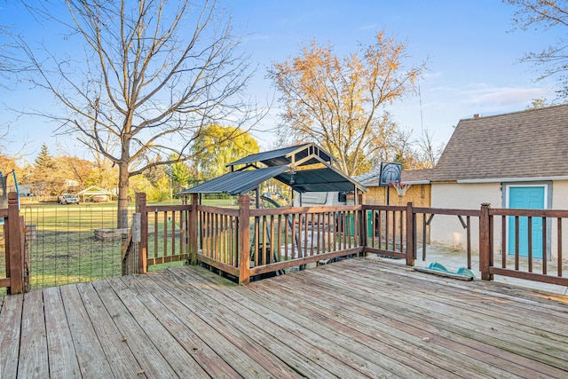 wooden deck featuring a yard