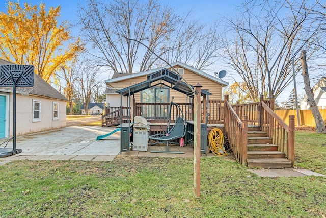 rear view of house with a yard and a patio area