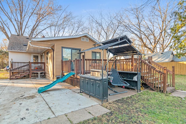 exterior space featuring a deck and a patio