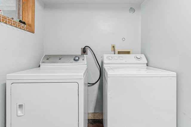 laundry area with separate washer and dryer