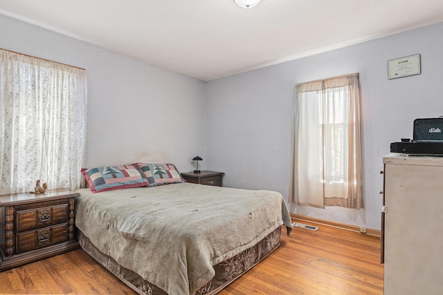 bedroom featuring hardwood / wood-style flooring