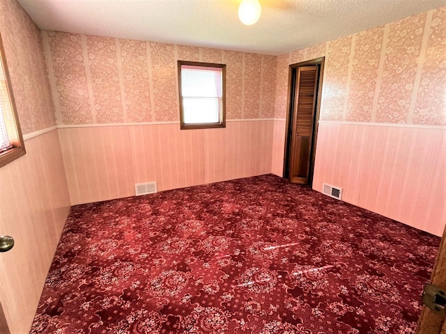 empty room with a textured ceiling