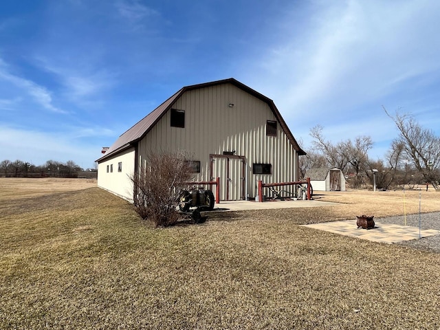 view of outbuilding featuring a yard