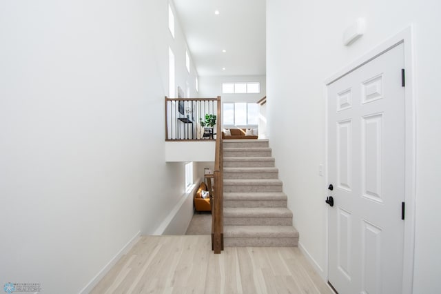 6652 32nd St S, Fargo, ND 58104 - staircase with wood finished floors, baseboards, and recessed lighting