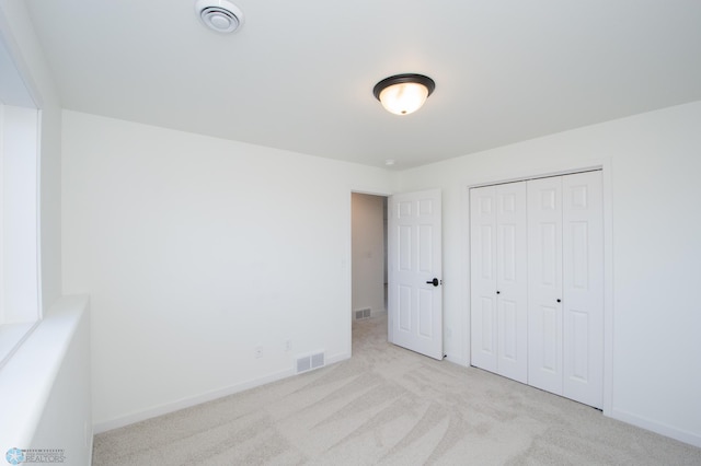 6652 32nd St S, Fargo, ND 58104 - unfurnished bedroom with carpet floors, baseboards, and a closet