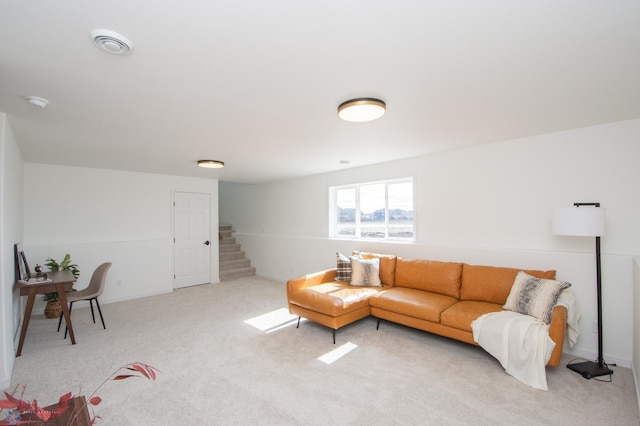 6652 32nd St S, Fargo, ND 58104 - living area with light carpet, stairway, and baseboards