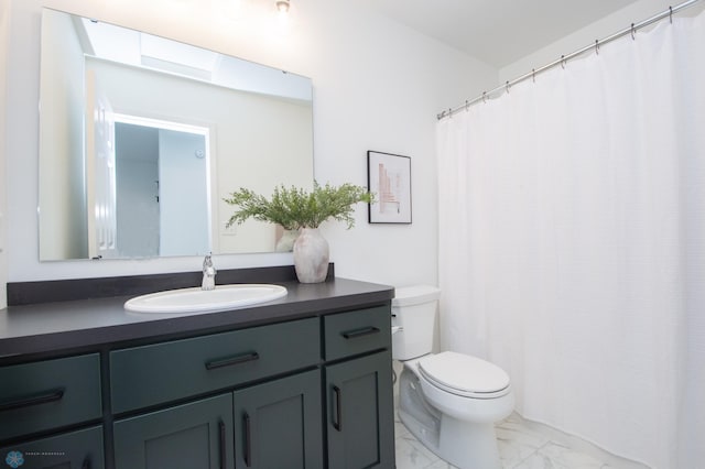 6652 32nd St S, Fargo, ND 58104 - full bathroom featuring marble look tile flooring, toilet, and vanity