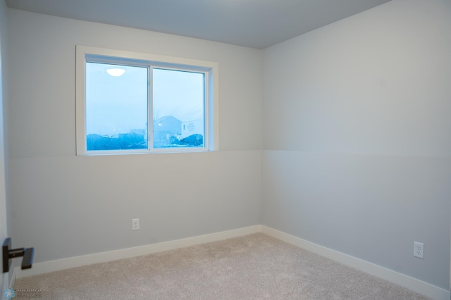 empty room featuring light colored carpet