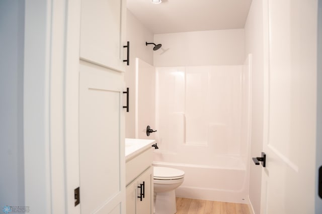 full bathroom with wood-type flooring, vanity, toilet, and shower / tub combination