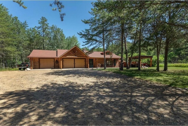 log cabin featuring a garage