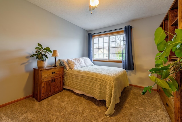 carpeted bedroom with a textured ceiling, vaulted ceiling, and ceiling fan