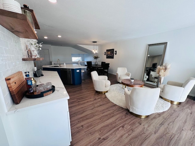 living room featuring dark hardwood / wood-style flooring and sink