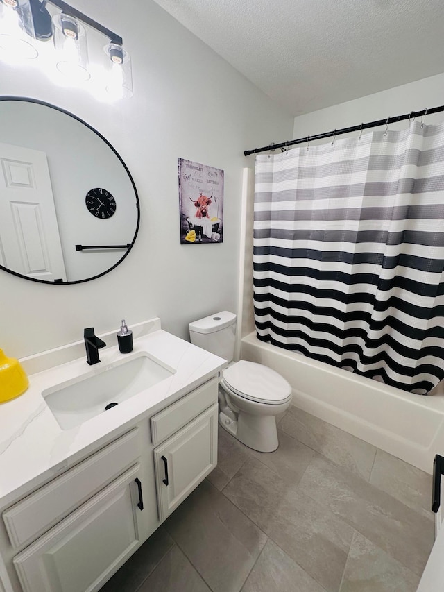 full bathroom featuring shower / bath combo, tile patterned flooring, a textured ceiling, toilet, and vanity