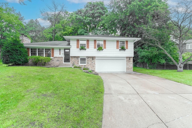 tri-level home with a garage and a front yard