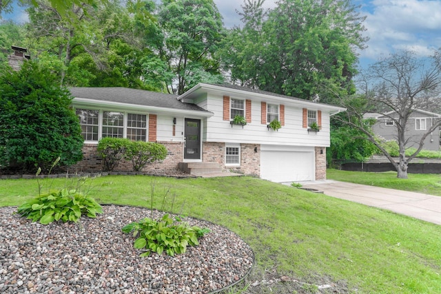 tri-level home featuring a garage and a front yard