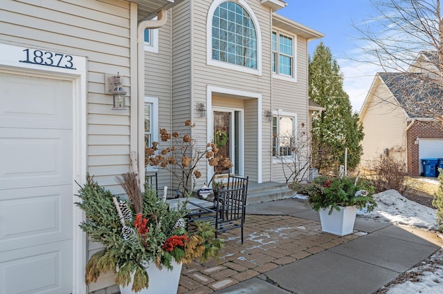 entrance to property with an attached garage